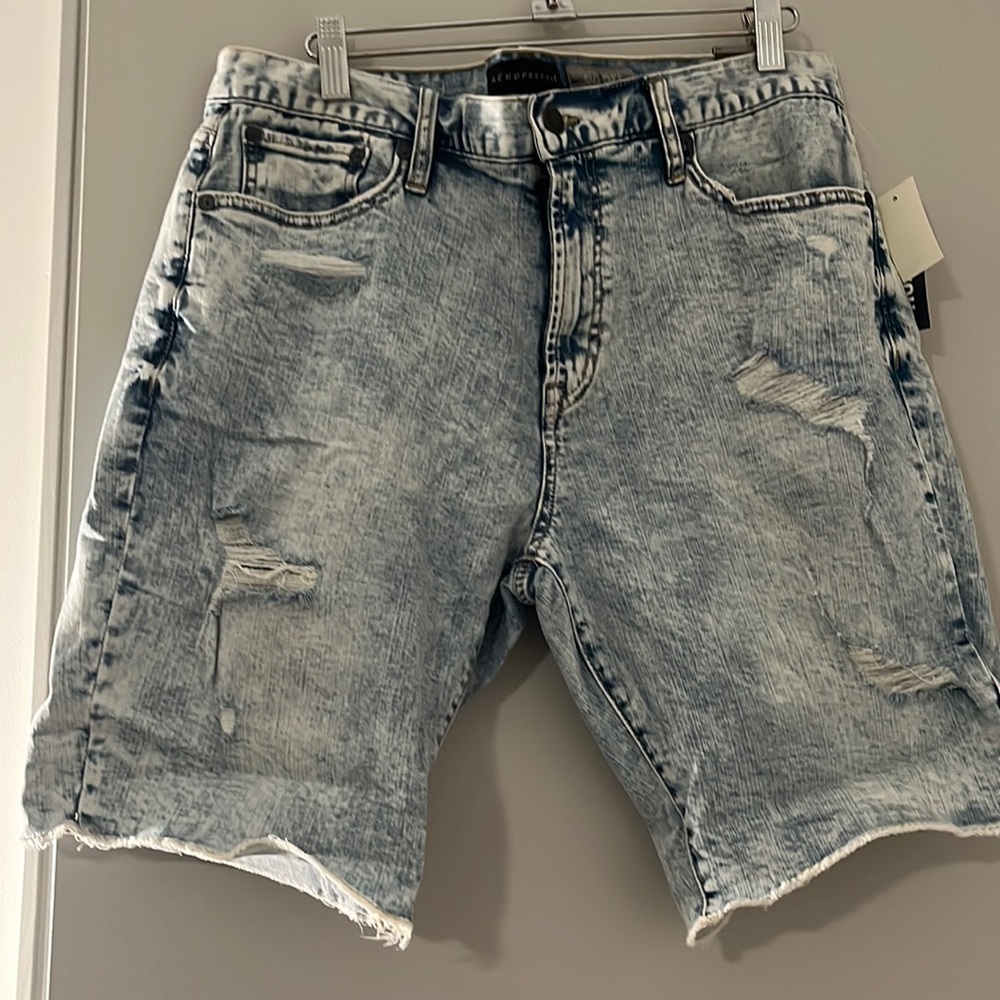 Aeropostale men’s distressed denim shorts. Size 33. Color light washed.